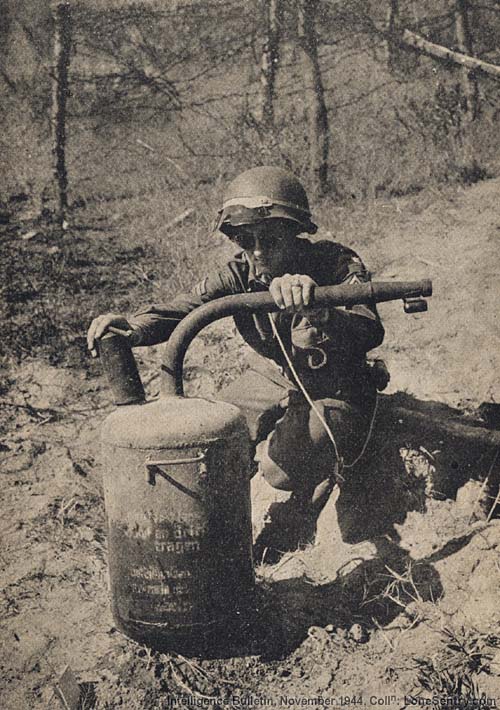 [A fougasse flame thrower which has just been lifted from its emplacement.]