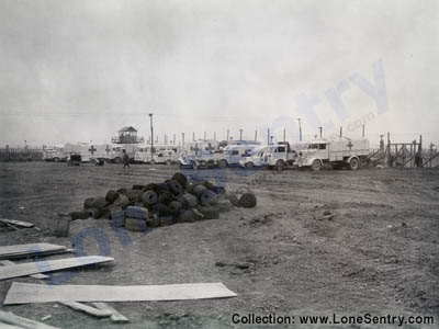 [Ambulances and medical vehicles outside prisoner of war camp, Italy, 1945]